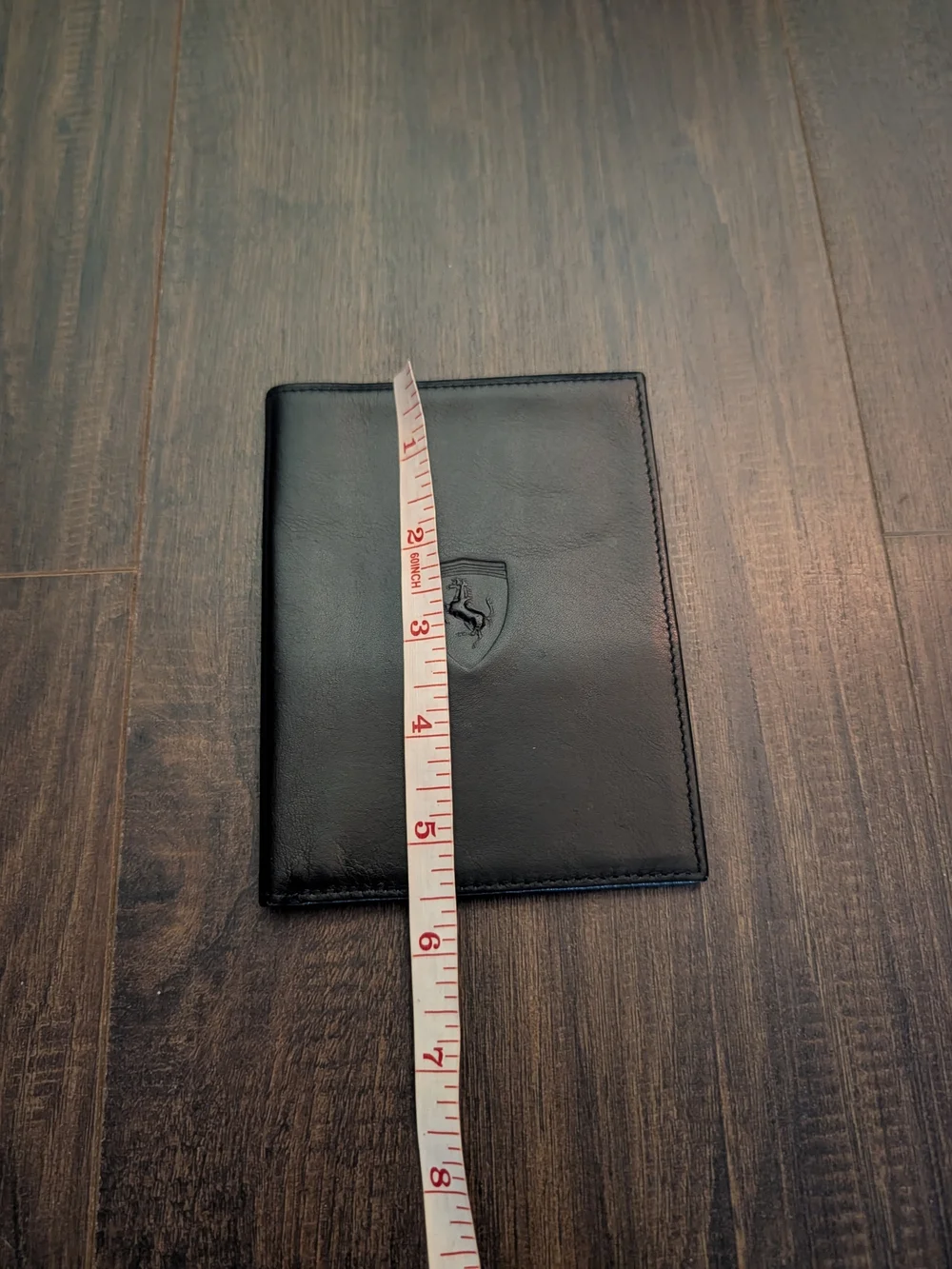 FERRARI Black Leather Passport Wallet with Embossed Shield Logo Red Inside